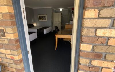 Accessible Accommodation Maitland. One spacious accessible room, with a queen bed & single bed & a step-free bathroom with shower chair.