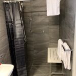 Accessible Accommodation Moorabbin - Sandbelt Club Hotel with step free shower, wall mounted shower chair and step free access.